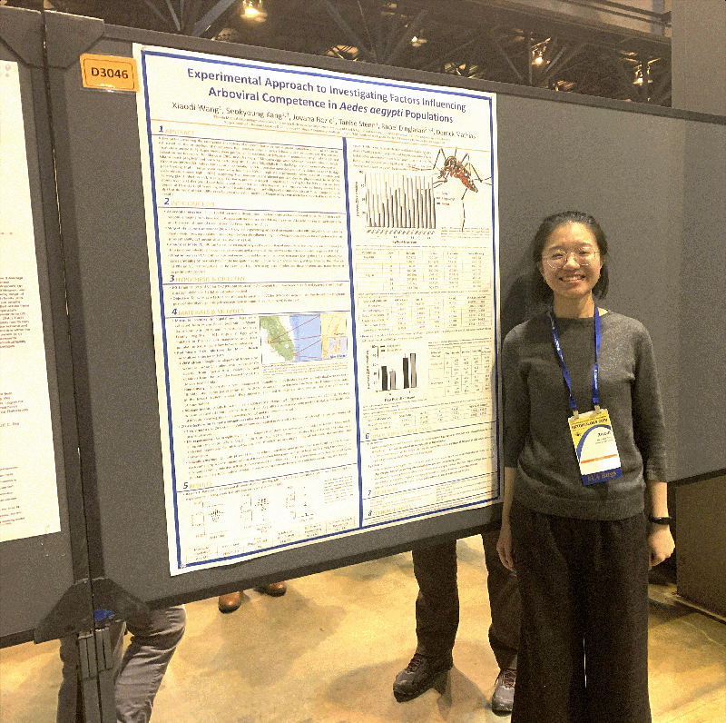 Miss Xiaodi in front of her 2nd place ESA MUVE research poster board