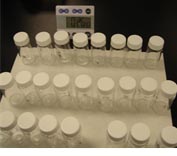 showing the small sampling bottles lined up in bottle racks
